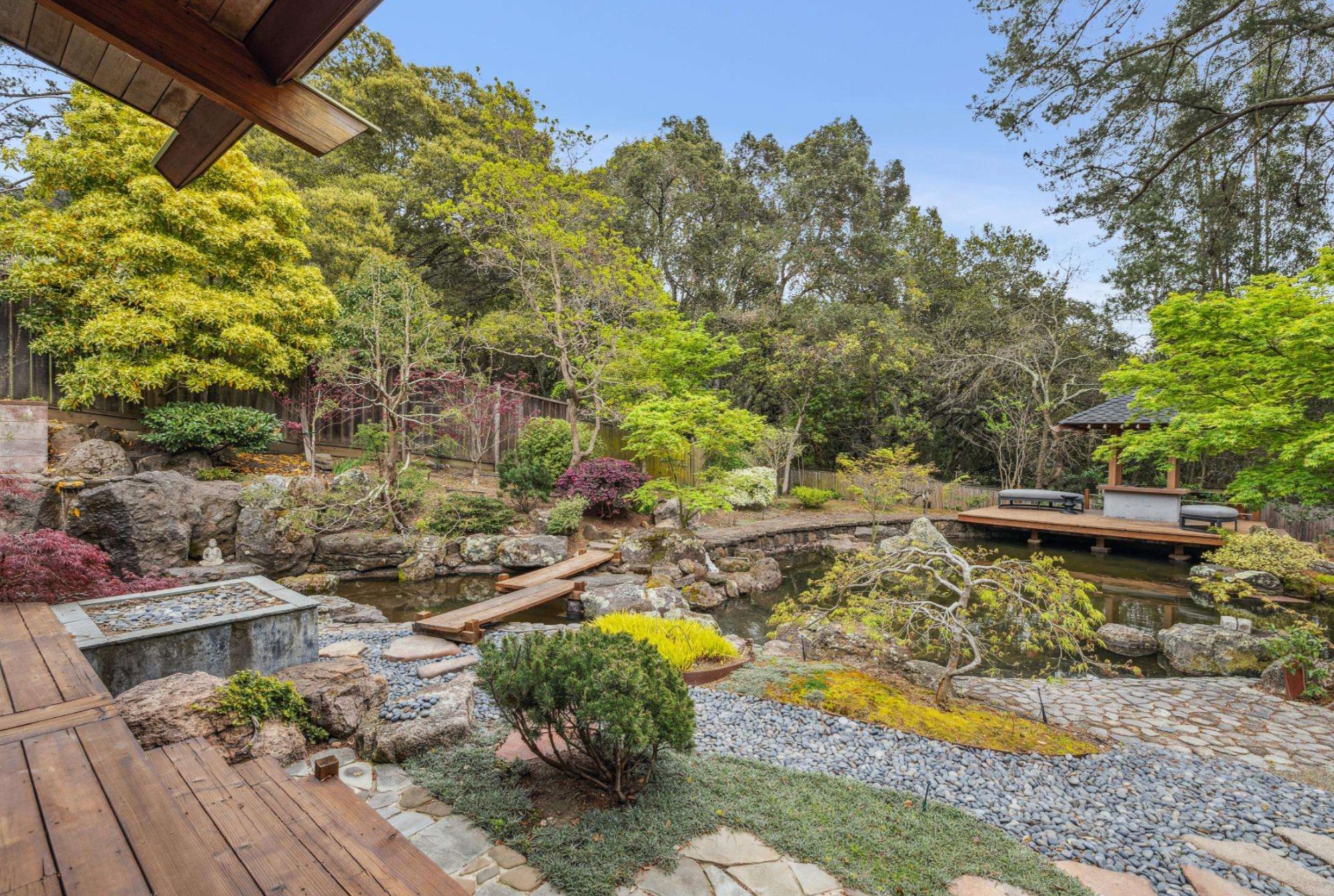 293 Elysian Fields Drive — Japanese tea garden with koi pond, stone paths, and sculpted maples
